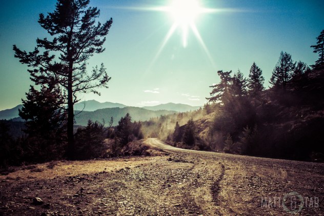 The sun's rays illuminating the dusty gravel road. © Tabitha Friesen 